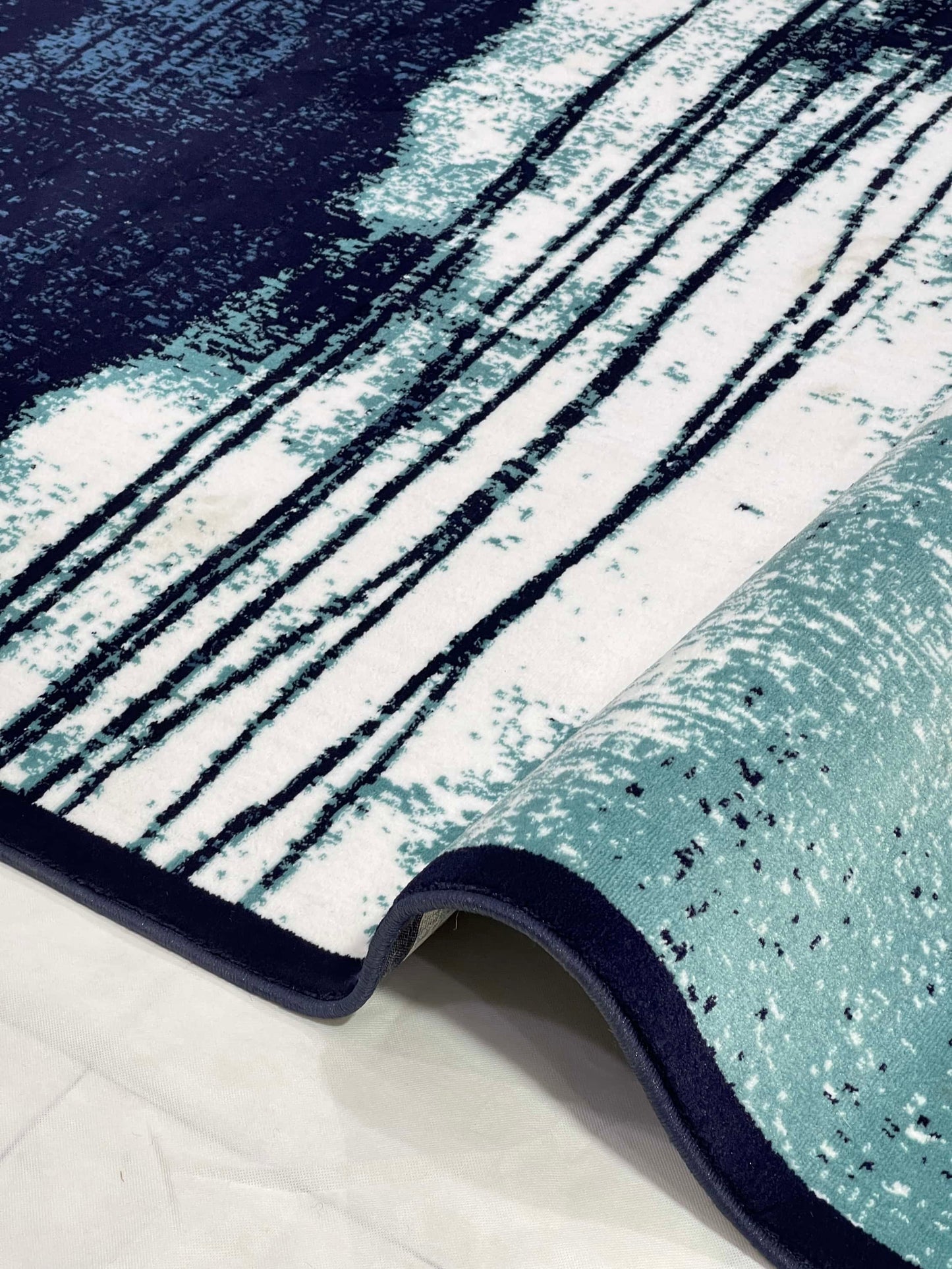 Modern polypropylene Rug,back woven(Article-7825-Blue)
Size : 6.6 ft width x 9.6 ft length (200cm x 290cm)