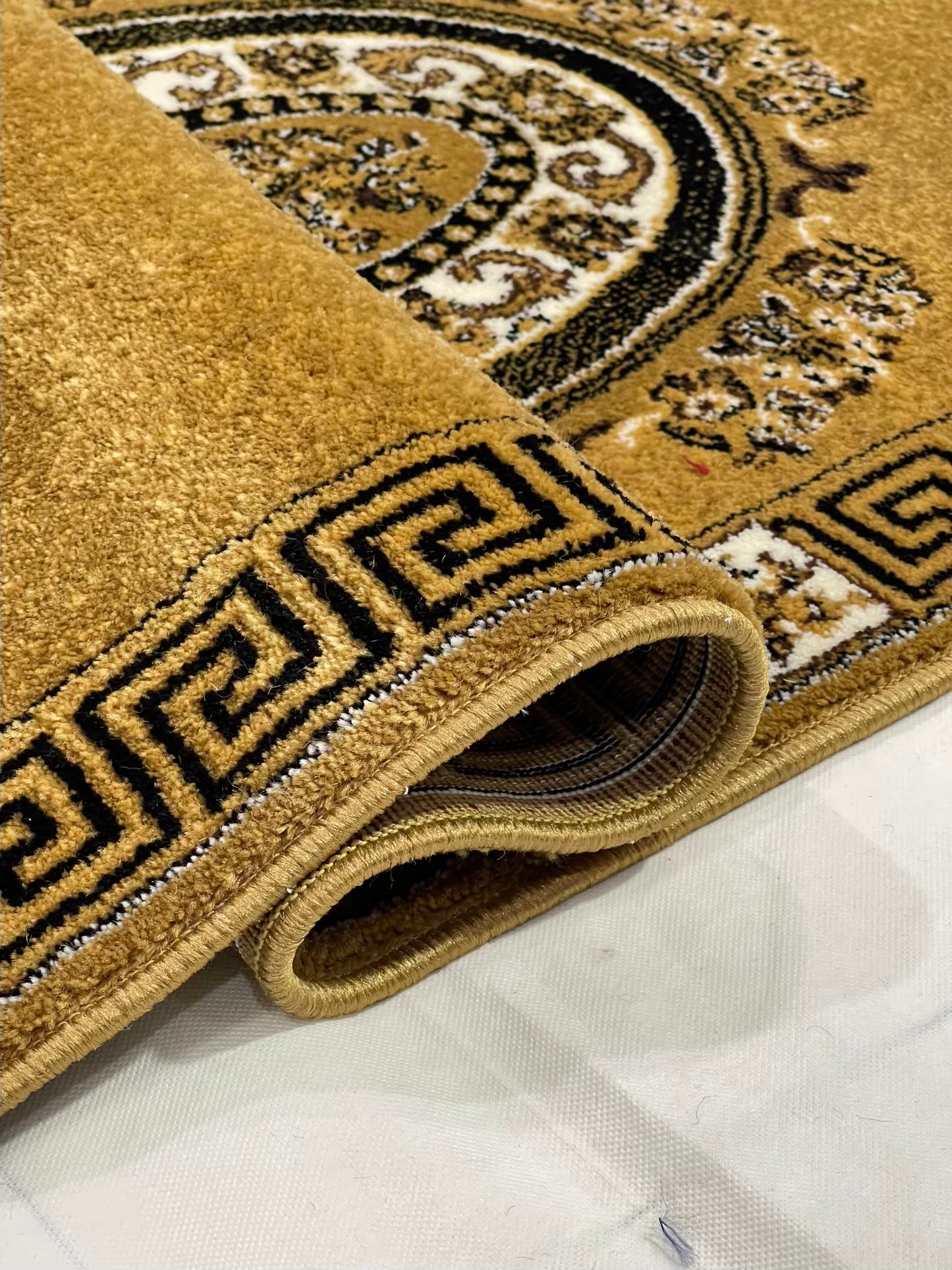 Gold Versace Polypropylene Woven Rug.
Size : 2.6 ft width x 6.6 ft length
(80 cm x 200cm)