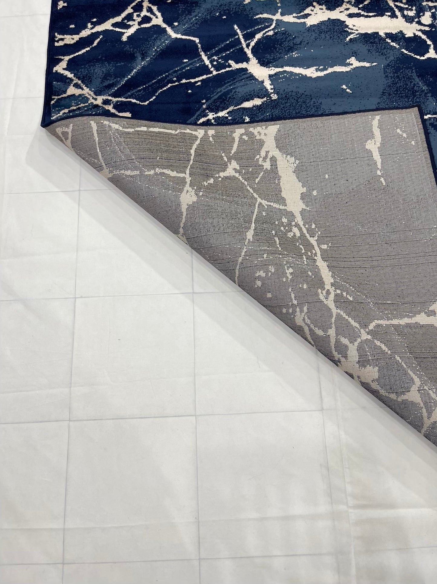 Modern polypropylene Rug,back woven(Article-3566-Blue)
Size : 6.6 ft width x 9.6 ft length (200cm x 290cm)