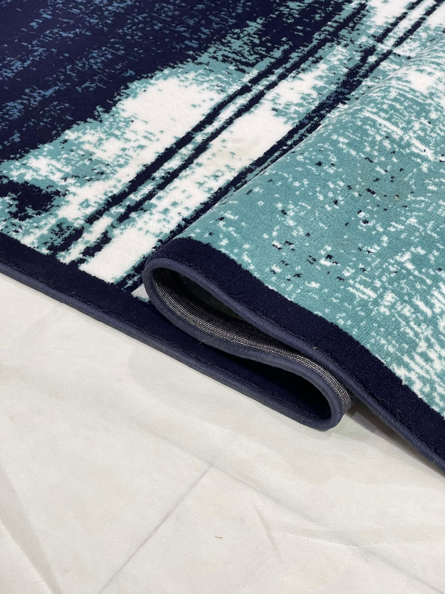 Modern polypropylene Rug,back woven(Article-7825-Blue)
Size : 6.6 ft width x 9.6 ft length (200cm x 290cm)