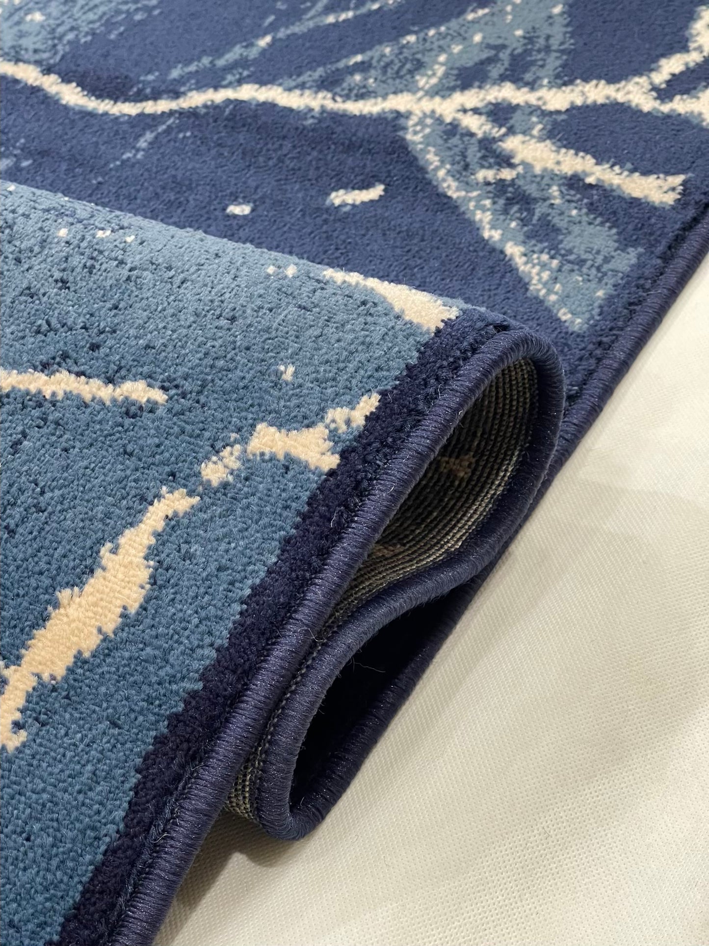 Modern polypropylene Rug,back woven(Article-3566-Blue)
Size : 6.6 ft width x 9.6 ft length (200cm x 290cm)