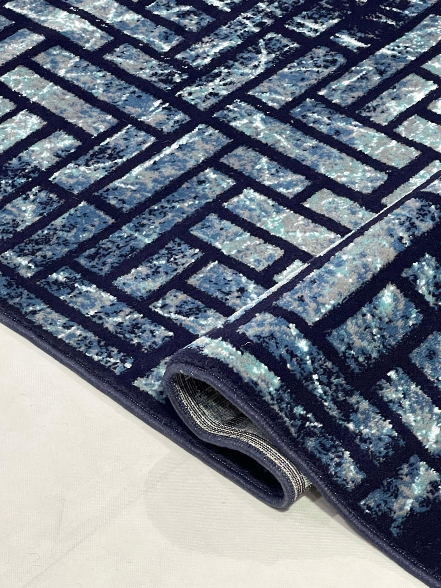 Modern polypropylene Rug,back woven(Article-1160-Blue)
Size : 6.6 ft width x 9.6 ft length (200cm x 290cm)